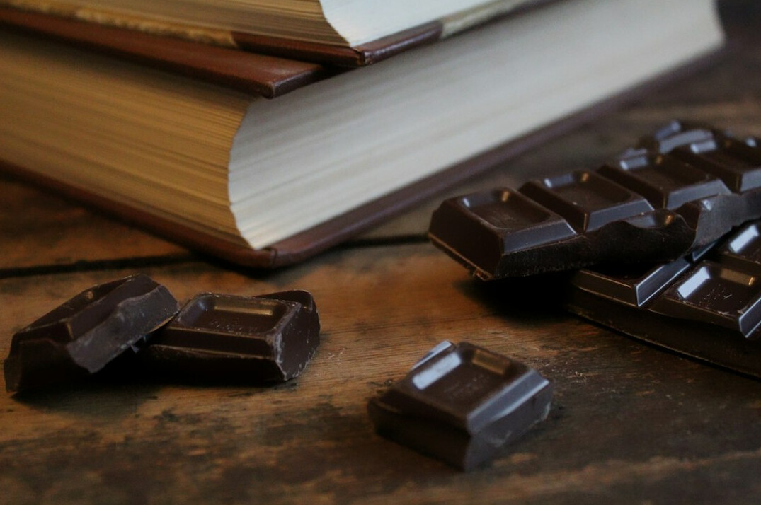 Stack of books on a wooden table