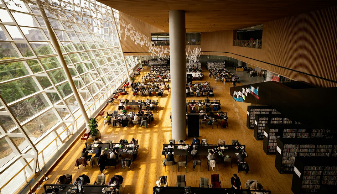 Quiet library reading hall with long tables