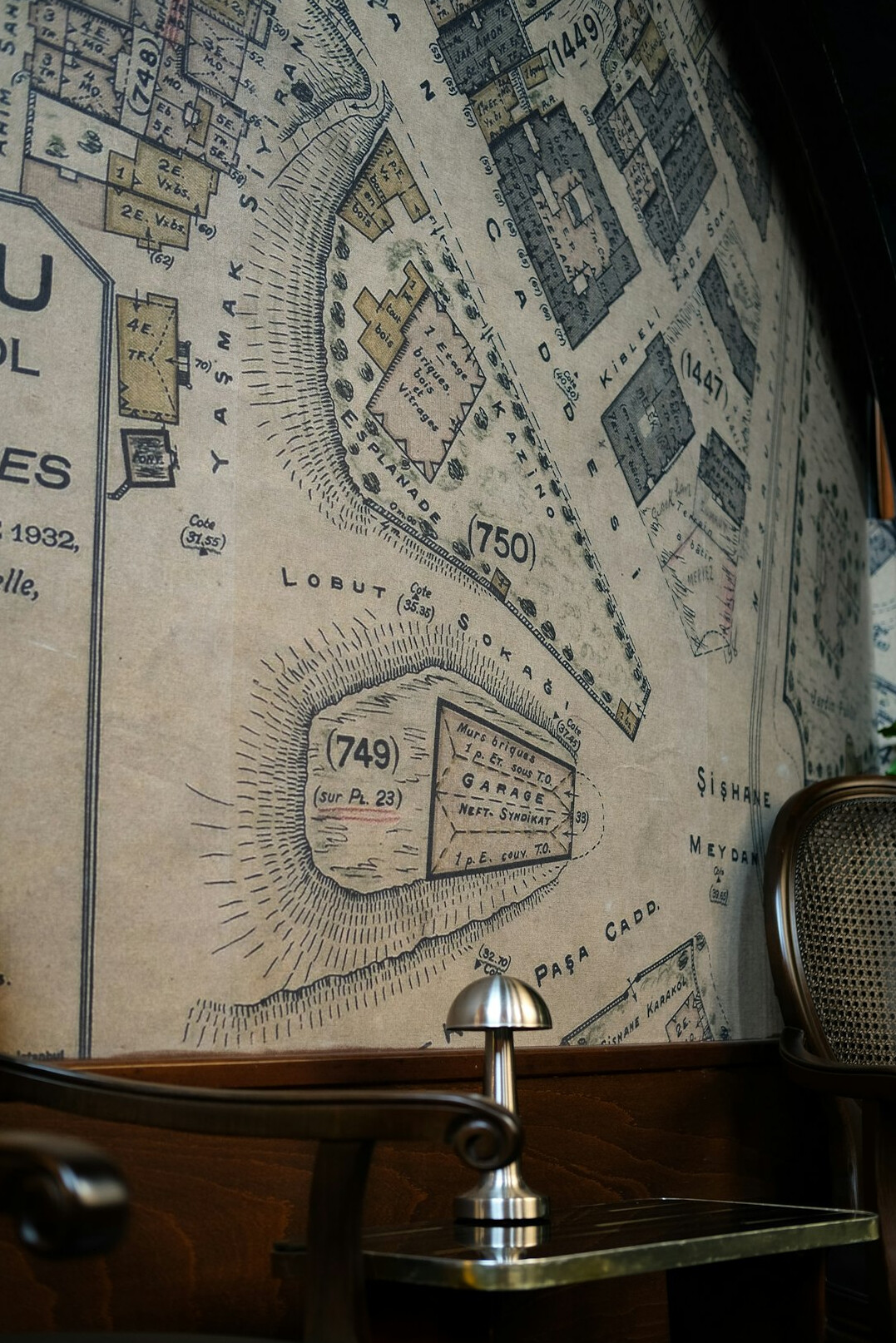 Old map spread on a table with a compass