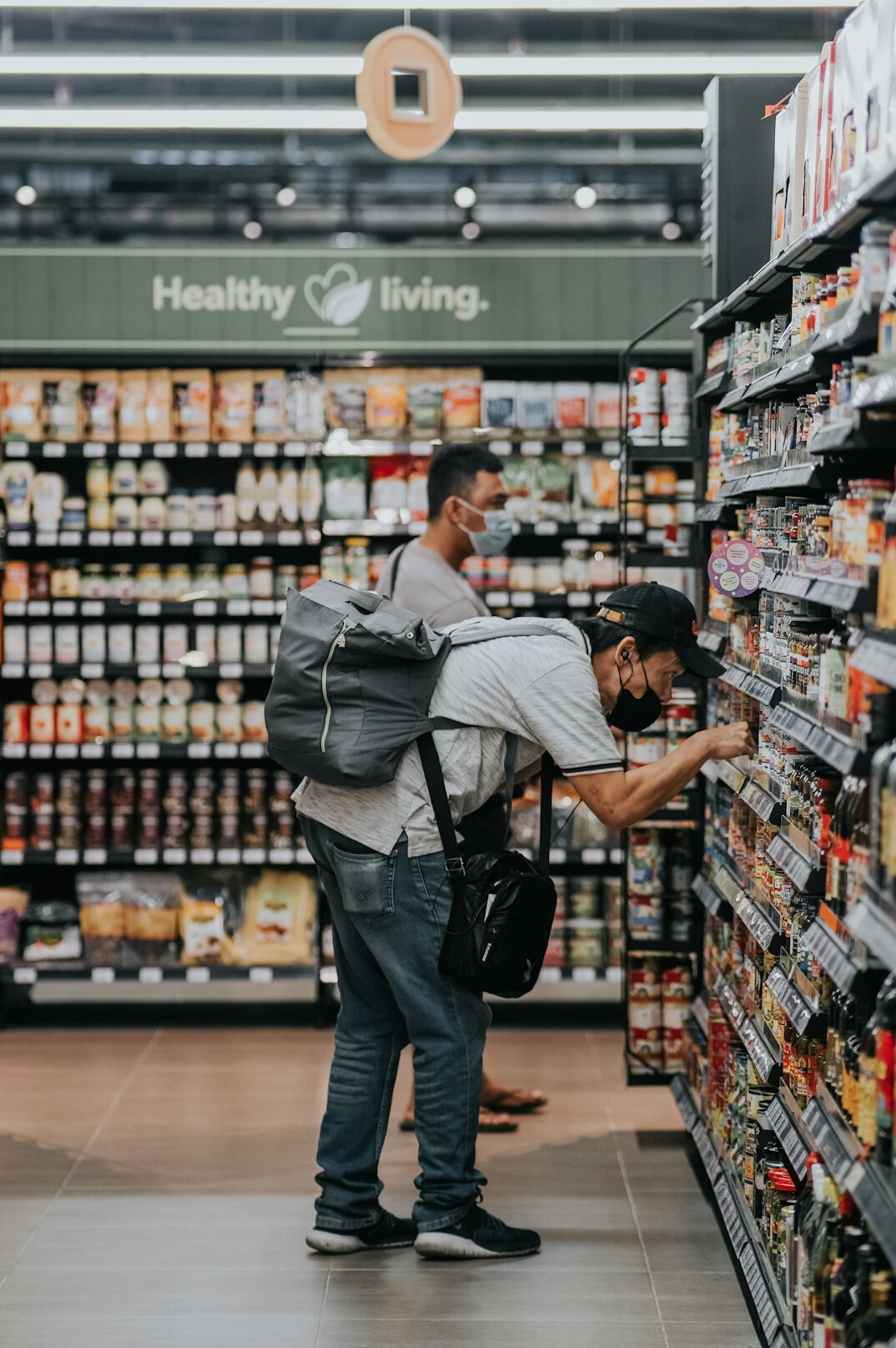 man running through grocery store