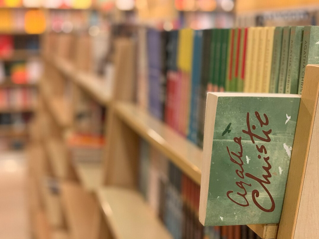 Rows of old books on library shelves