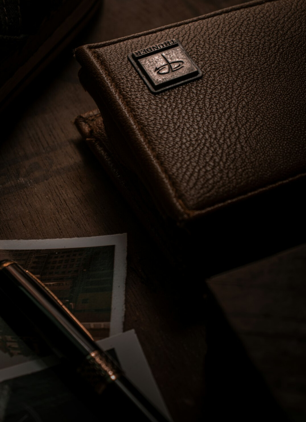 Detective notebook with pen on a table